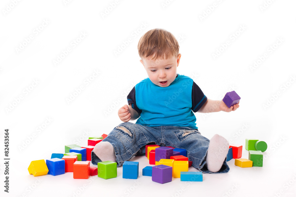 Baby boy playing with colorful toys bricks Baby boy playing with colorful toys bricks