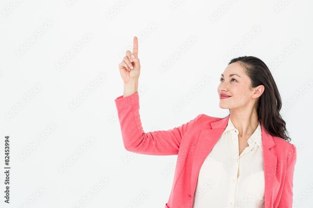 Smiling beautiful woman pointing up with her finger Smiling beautiful woman pointing up with her finger