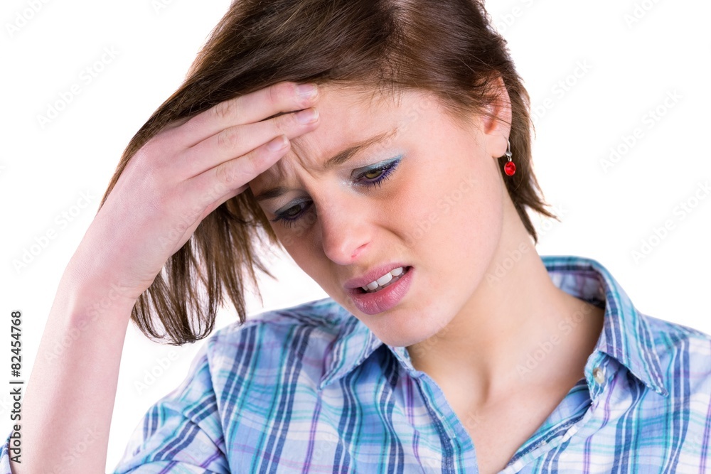 Pretty brunette getting a headache with hands on head Pretty brunette getting a headache with hands on head