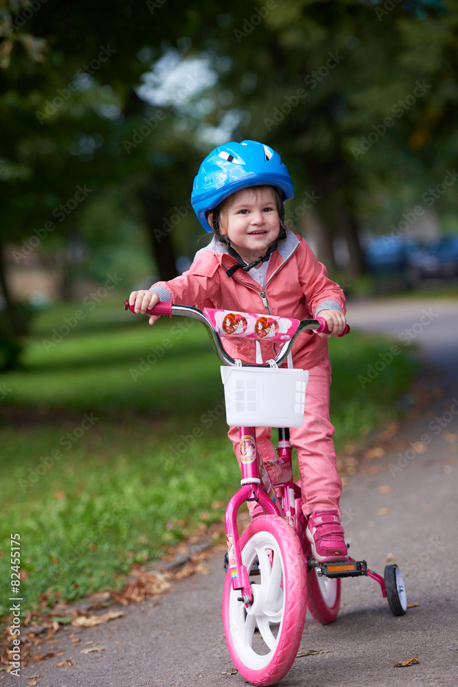 little girl with bicycle