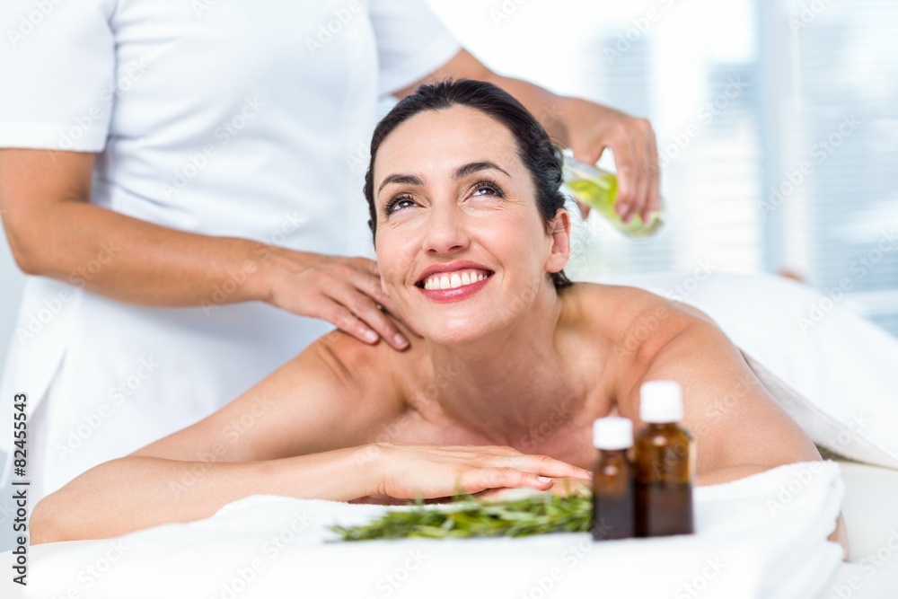 Smiling woman getting an aromatherapy treatment Smiling woman getting an aromatherapy treatment