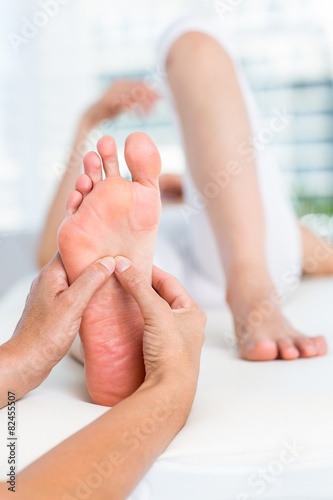 Physiotherapist massaging her patients foot © WavebreakmediaMicro