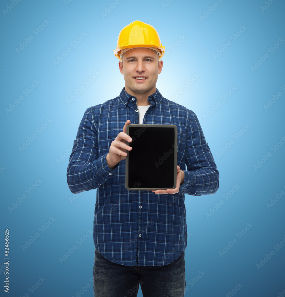 smiling male builder in helmet with tablet pc smiling male builder in helmet with tablet pc