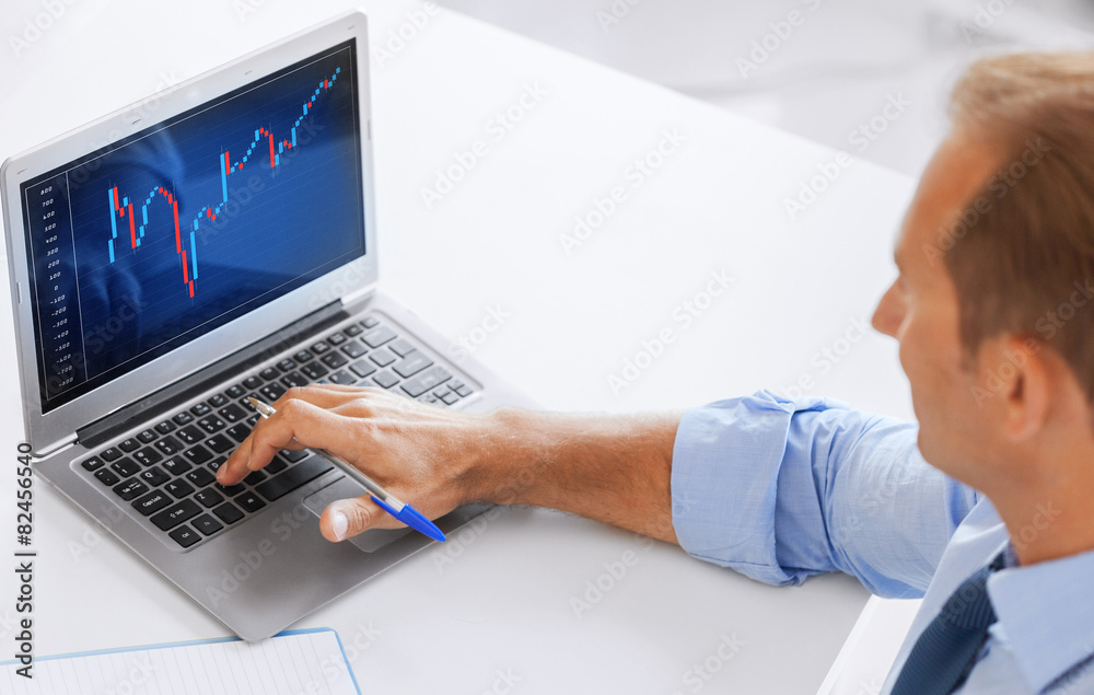 businessman working with forex chart in office businessman working with forex chart in office