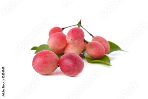 Red karonda fruit isolated on white background.