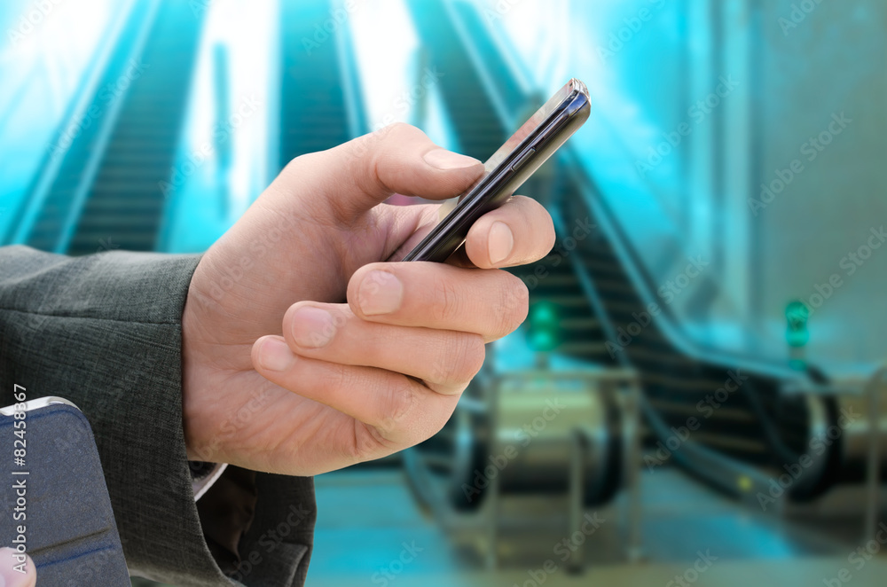 man holds phone in hand man holds phone in hand