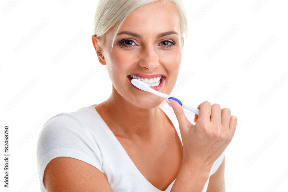 young lady holding toothbrush and smiling young lady holding toothbrush and smiling