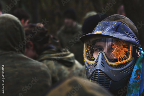 paintball player in protective uniform and mask