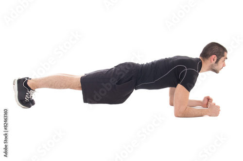 handsome man in sportswear doing exercises for abdominal muscles