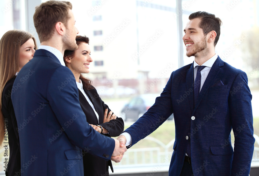 Business people shaking hands, finishing up a meeting Business people shaking hands, finishing up a meeting