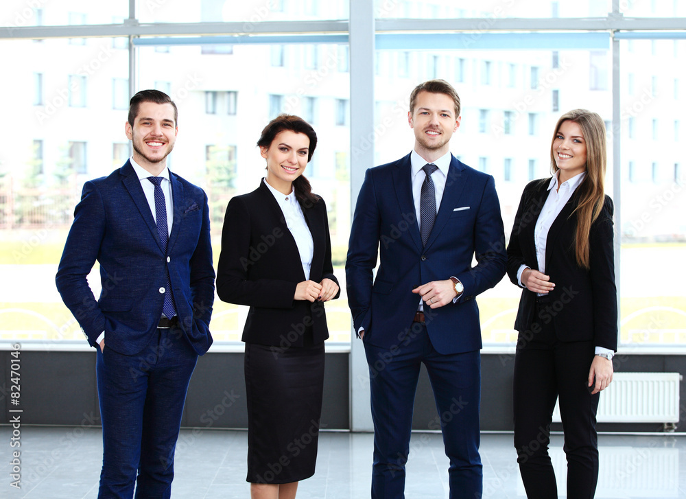 Happy smiling business team in office Happy smiling business team in office