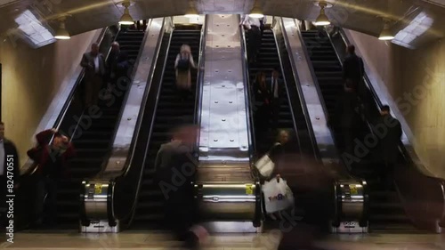 Time lapse wide shot of people on escalators at Grand Central Station / New York City, New York, United States