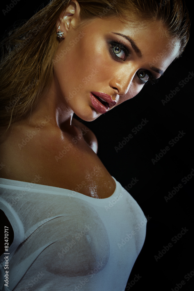 Sexy blonde woman posing wet