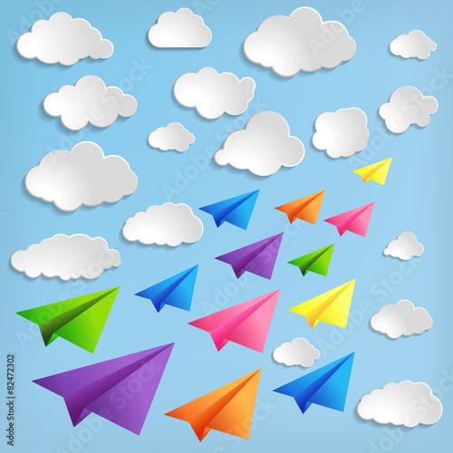 Paper airplanes with clouds on blue background
