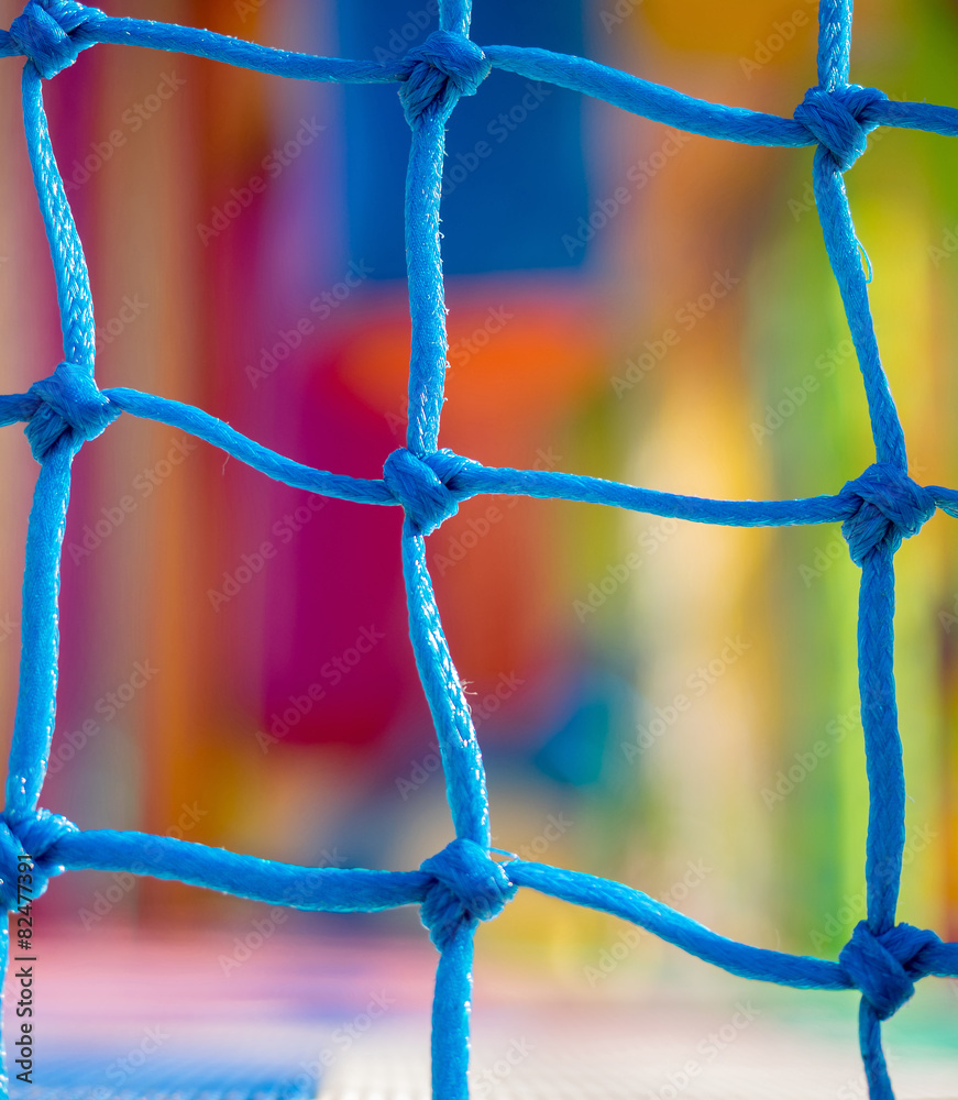 Blue net  in children playground. Focus on net