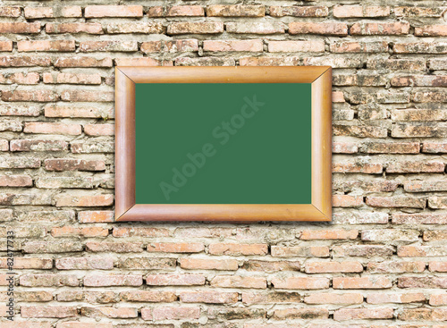 Red brick wall texture with wood image frame