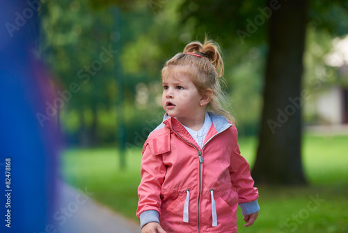 little girl have fun in park