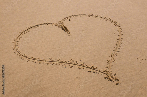 Beach background with hearts drawing on summer