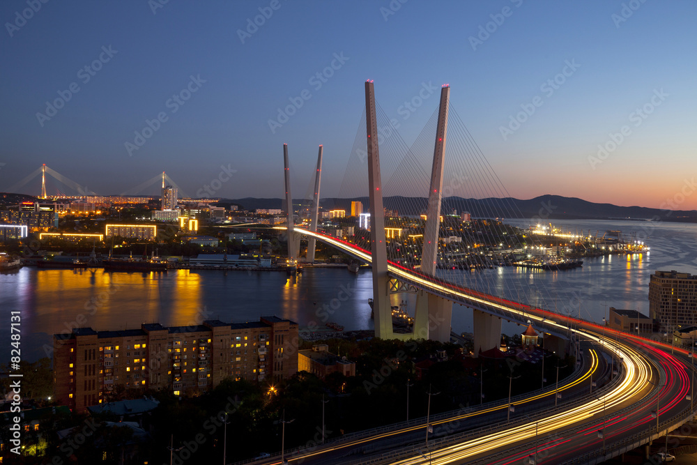 Panorama of night Vladivostok. Golden bridge. Russia