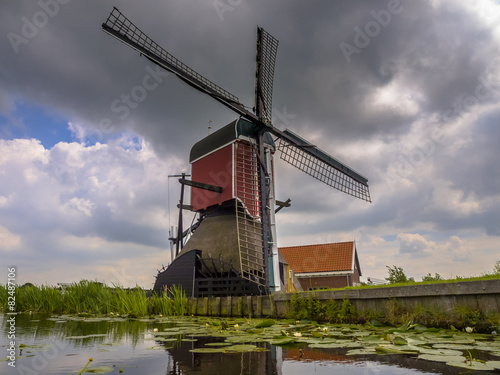 Historic wooden windmill photo