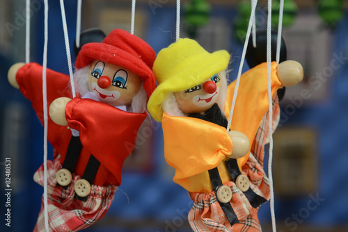 Marionette - puppet: Dolls on rope swing photo