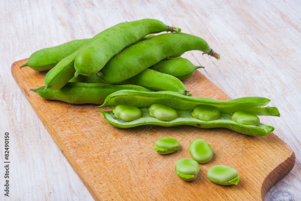 Fresh broad bean on kitchen board Fresh broad bean on kitchen board