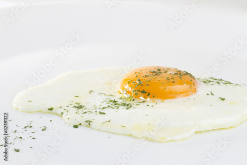Fried egg on white background