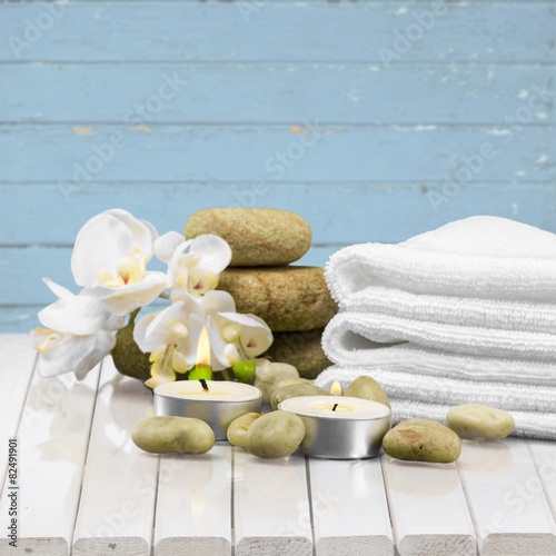 Spa Treatment. Gladiola  towel  candles and river stones