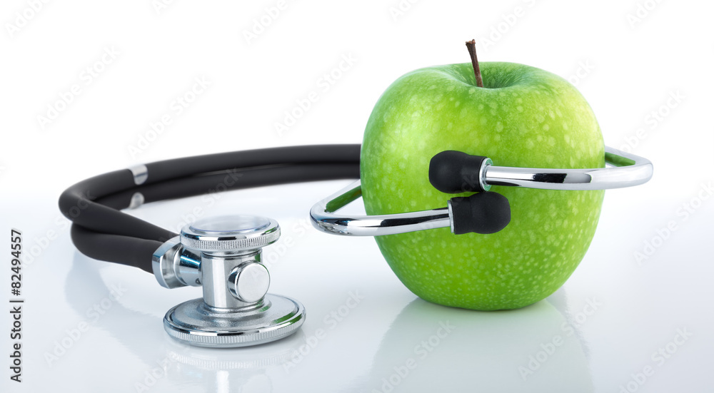 apple and stethoscope - healthy diet - nutrition checkup apple and stethoscope - healthy diet - nutrition checkup
