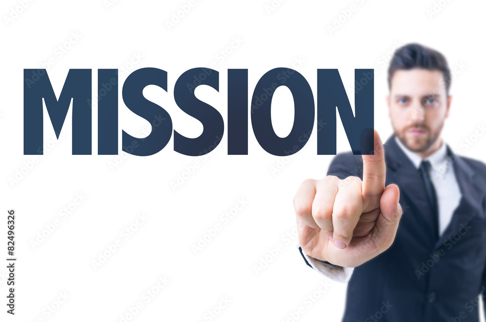Business man pointing the text: Mission Business man pointing the text: Mission