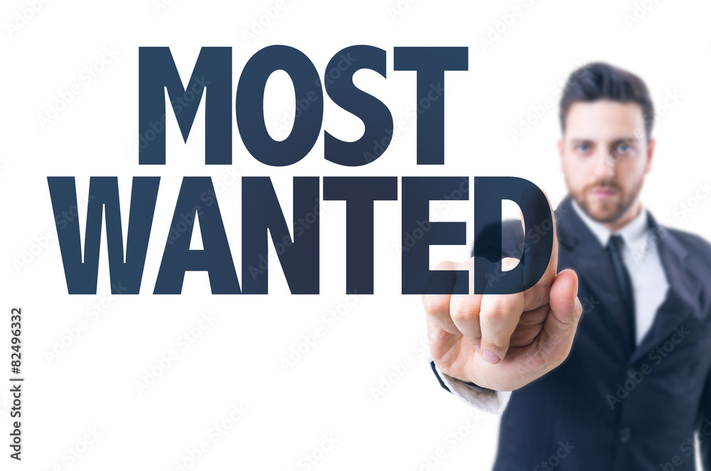 Business man pointing the text: Most Wanted Business man pointing the text: Most Wanted