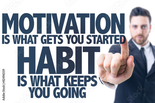 Business man pointing the text: Motivation Quote