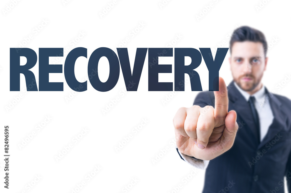 Business man pointing the text: Recovery Business man pointing the text: Recovery