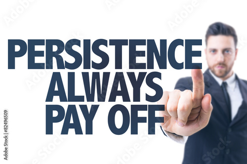 Business man pointing the text: Persistence Always Pay Off