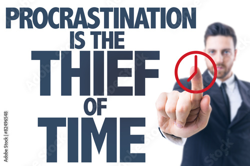 Business man point: Procrastination Is The Thief of Time
