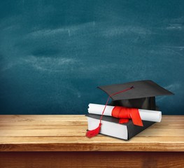 Graduation. Diploma and graduation cap