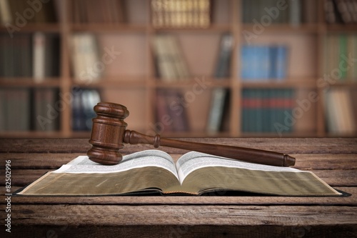 Legal System. Gavel over the opened law book