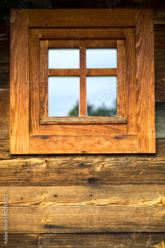 Wooden window at wooden wall