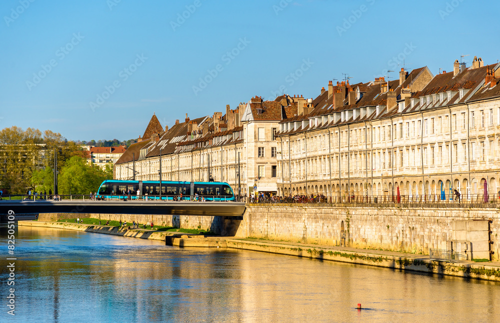 Naklejka premium View of embankment in Besancon with tram on a bridge - France
