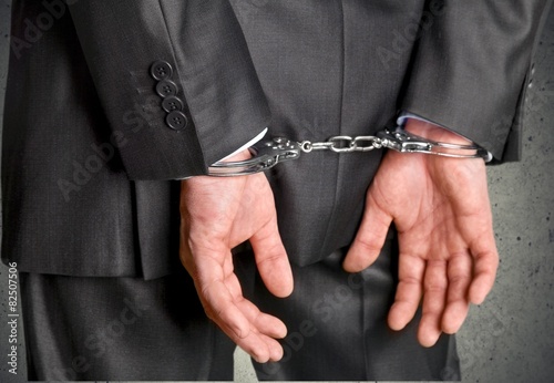 Handcuffs. Corporate crime