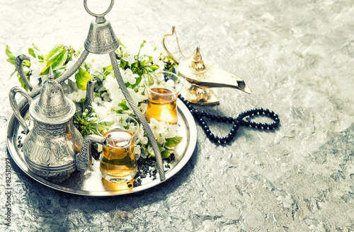 Oriental silver tea tableware, arabian lantern and rosary. Islam