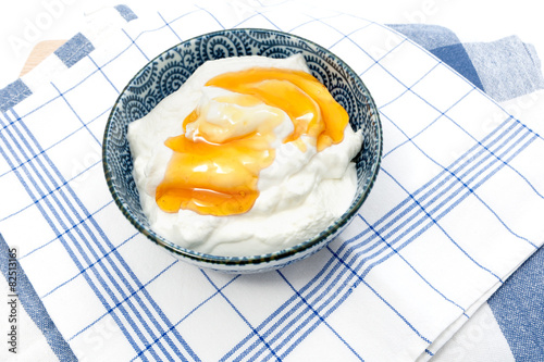 Greek yogurt with honey in a pot