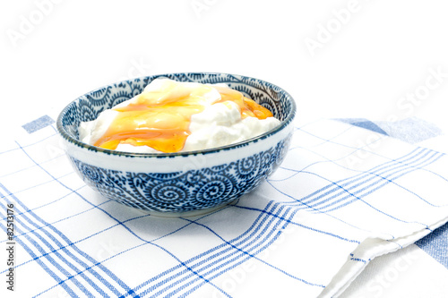 Greek yogurt with honey in a pot