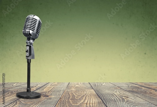 Audience. Vintage silver microphone isolated on white background