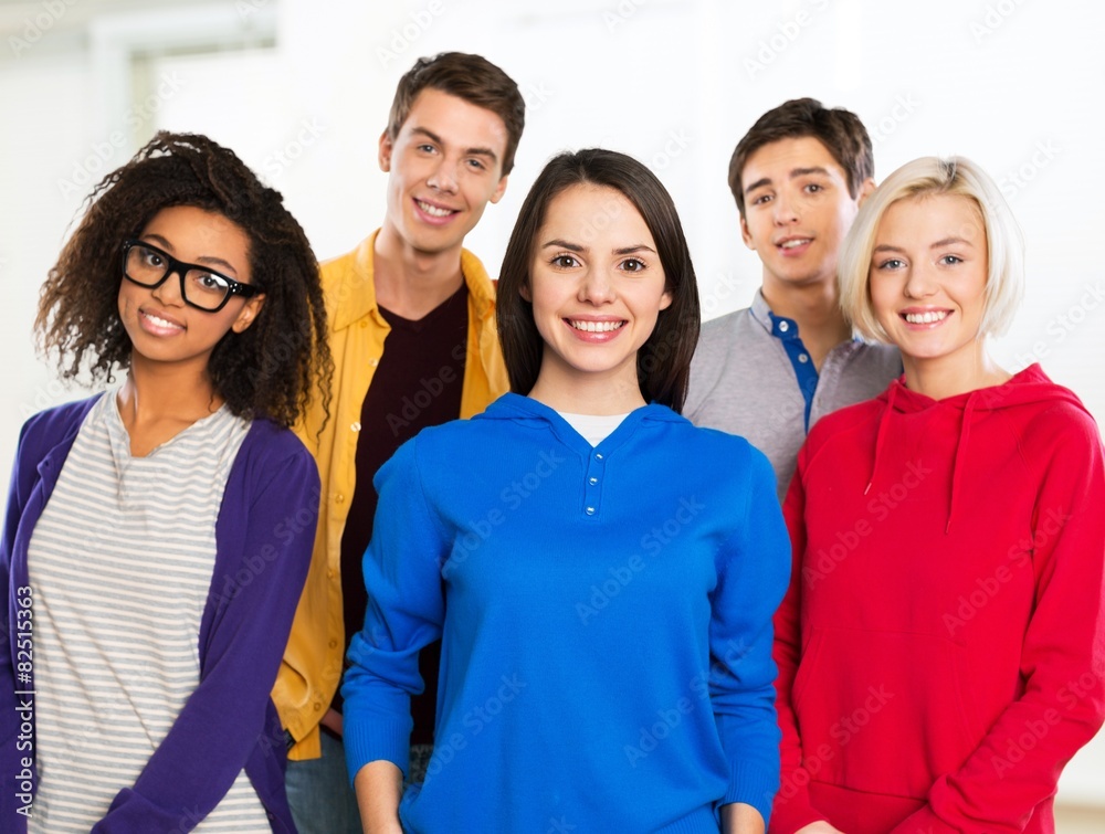 Studying. Education concept - group of students at school Studying. Education concept - group of students at school