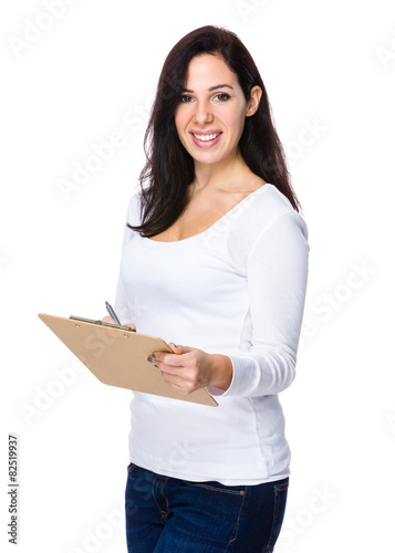 Brunette woman hold with clipboard and pen