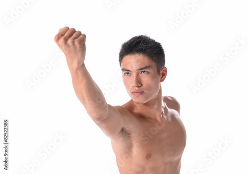 Young male showing biceps and fist
