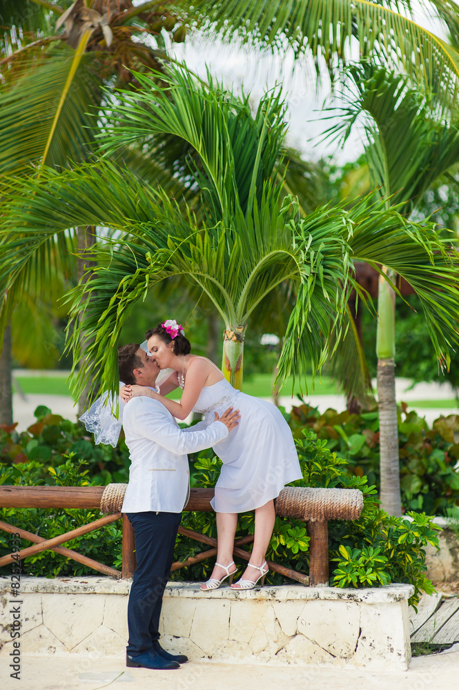 young loving couple on tropical sea background - wedding on