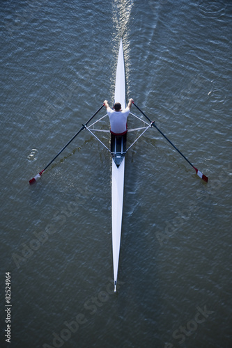 High angle view of a man rowing a single scull row boat