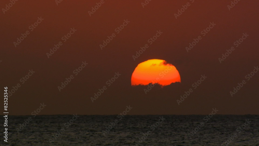 Sunrise or sunset over water with clouds Sunrise or sunset over water with clouds